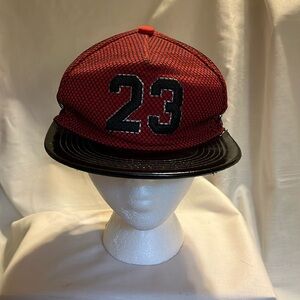 Black and red cap, number 23